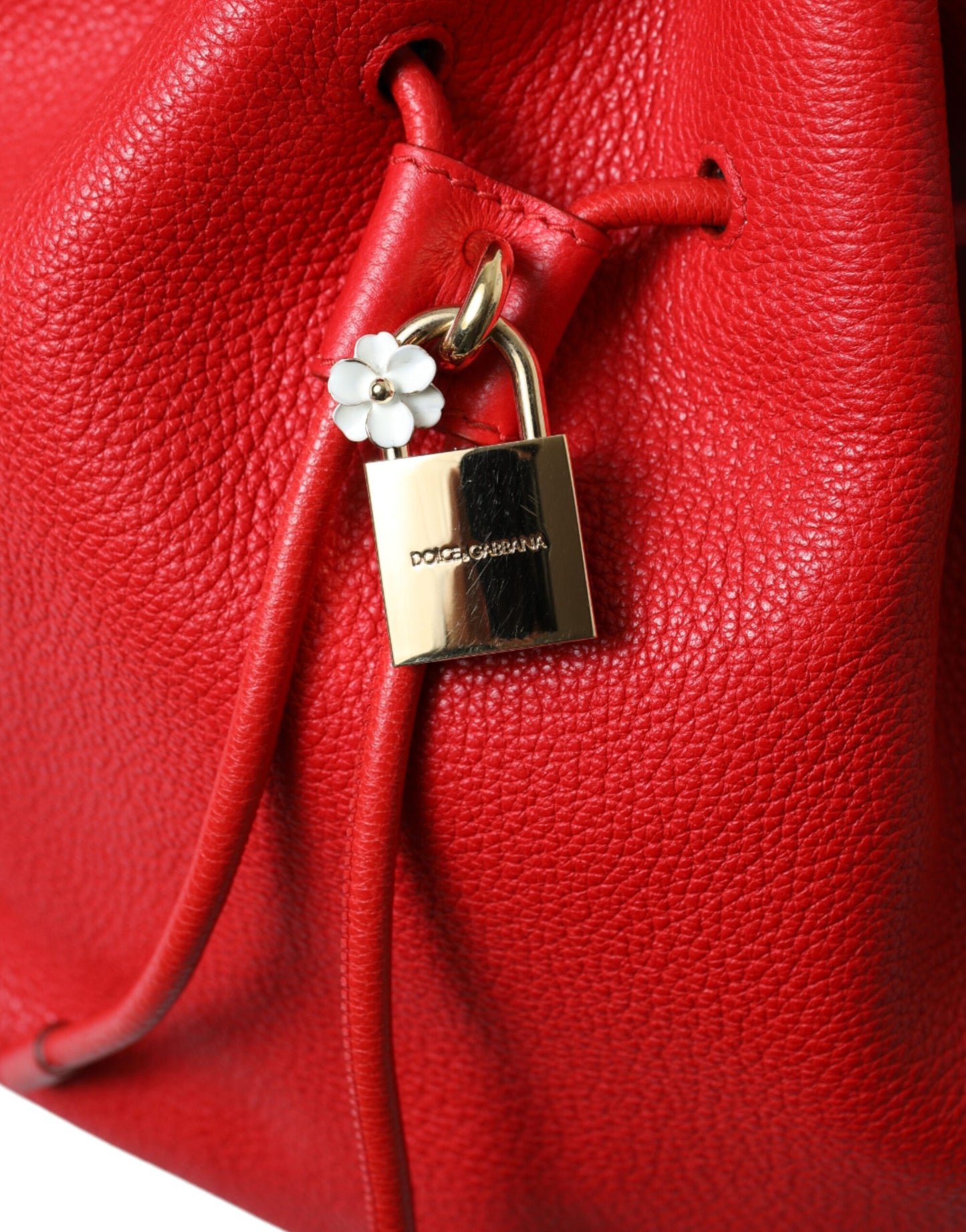 Elegant Red Leather Drawstring Bag with Gold Detailing