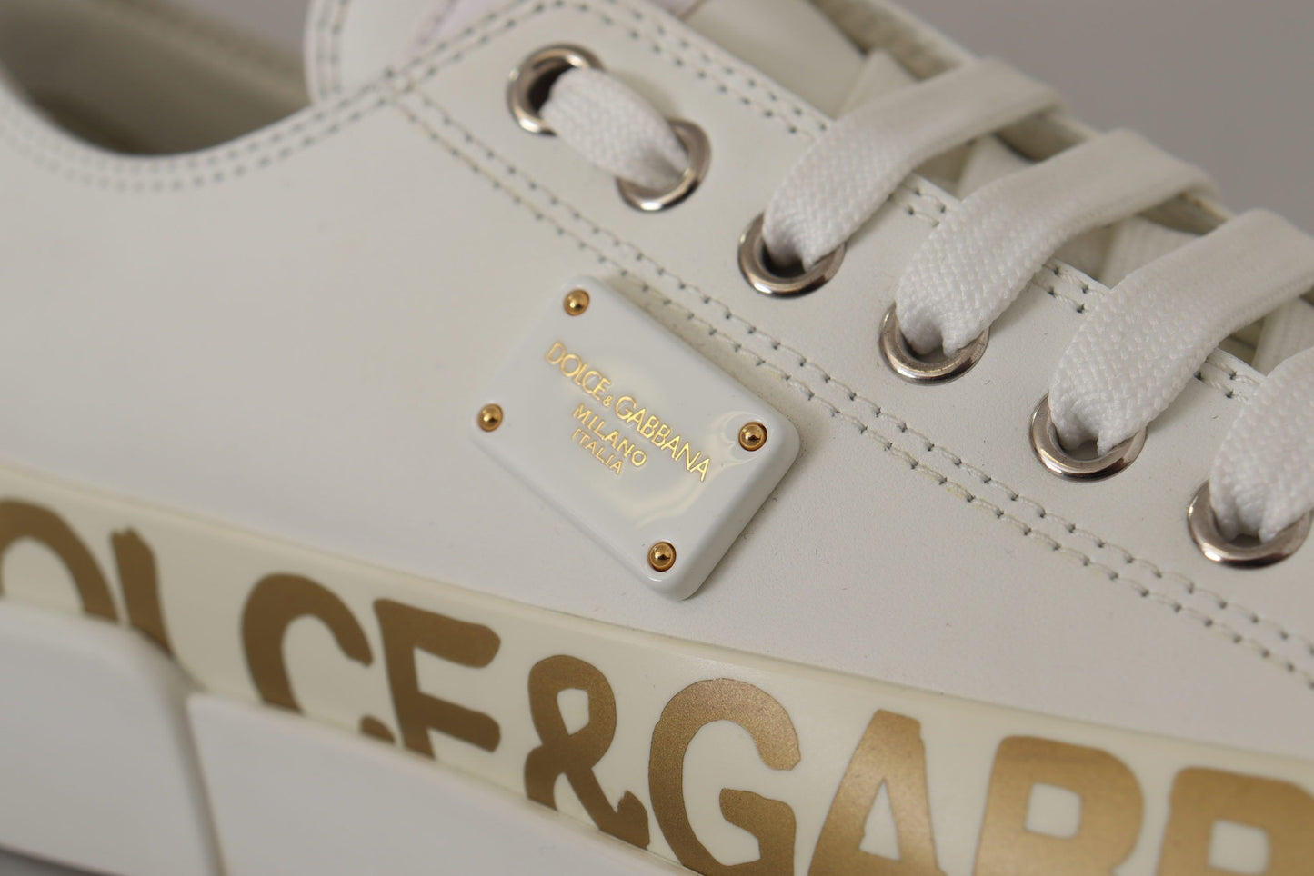 Elegant Gold Logo Leather Sneakers